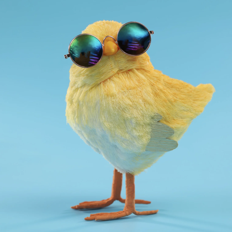 A yellow bird wearing sunglasses against a blue background